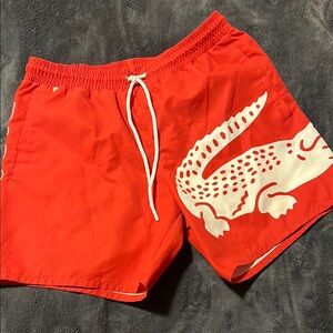 Lacoste Red Swim Trunks with Bold Crocodile Design